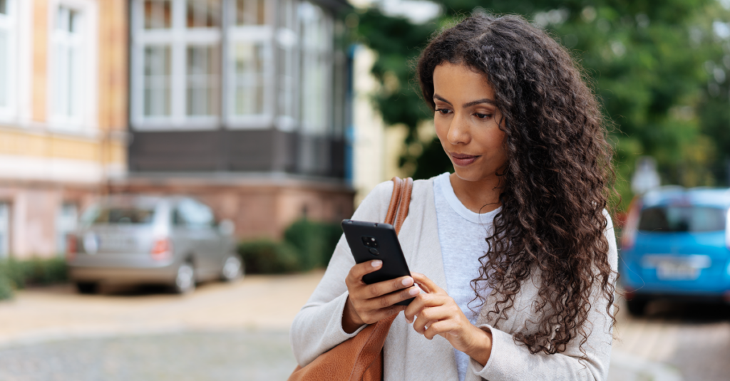 female interacting with cell phone